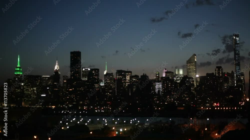 Time lapse of the Midtown Manhattan skyline and the East River at dawn, New York City, USA. Time lapse of the Midtown Manhattan skyline and the East River at dawn, New York City, USA.