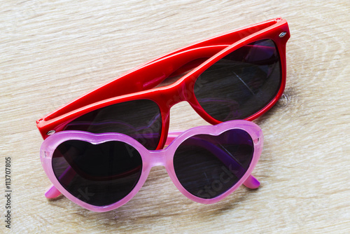 Red and pink sunglasses with heart-shaped