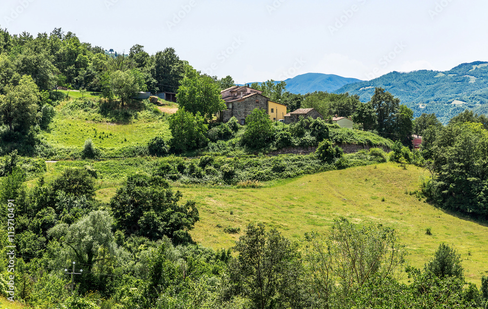 rural landscape with houses standing alone in the province of Tu