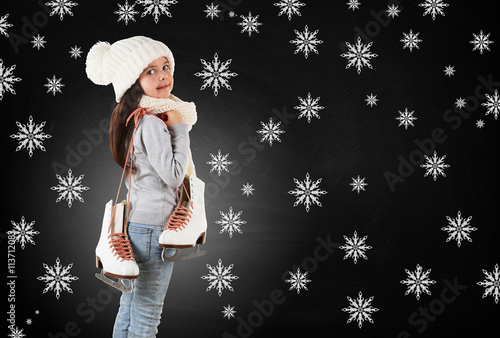 Little girl with skates in ...