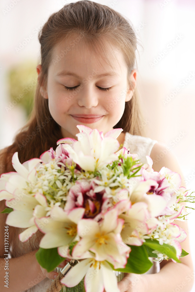 Beautiful small girl with fresh spring bouquet Beautiful small girl with fresh spring bouquet