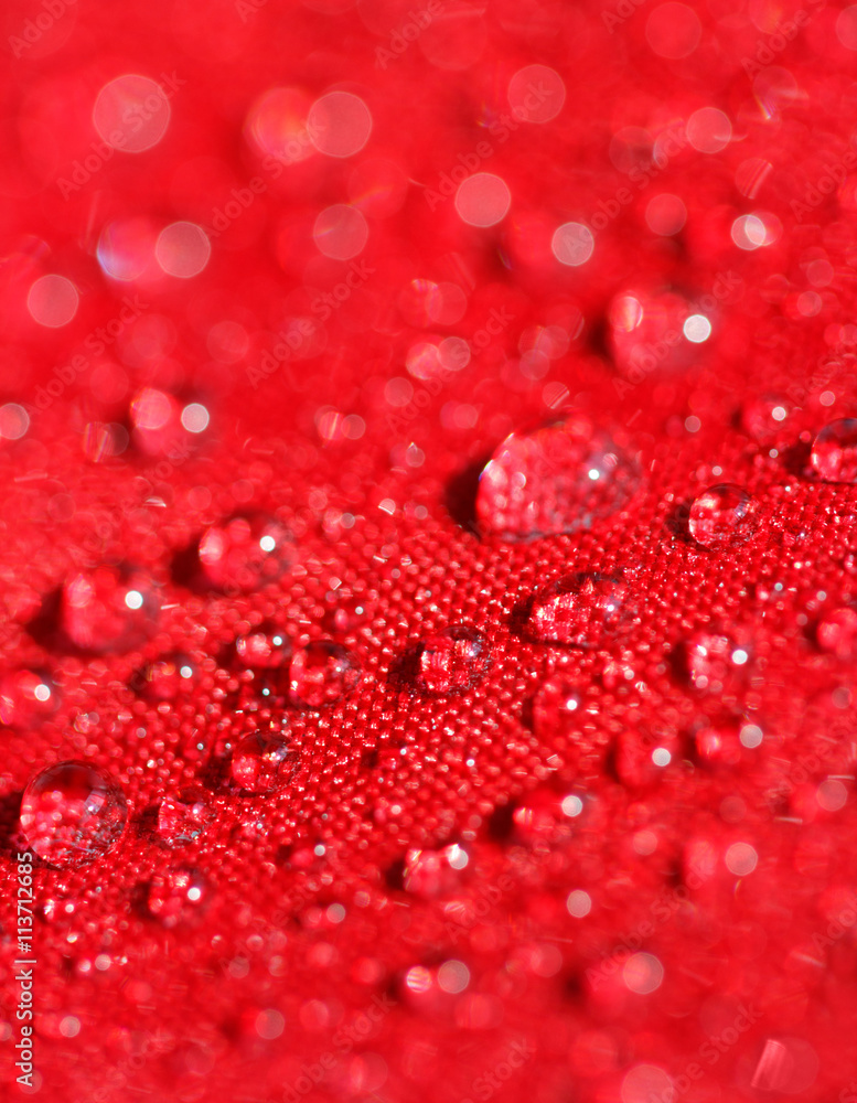 water drops on the red umbrella fabric water drops on the red umbrella fabric