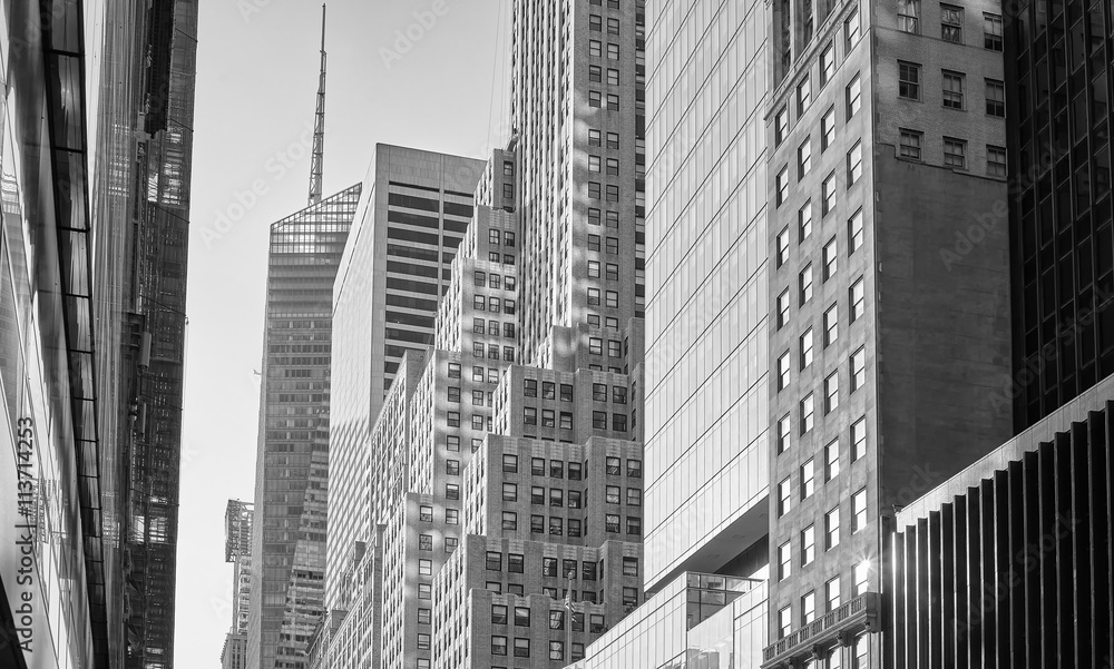 Fototapeta premium Old style black and white picture of Manhattan buildings, New York, USA