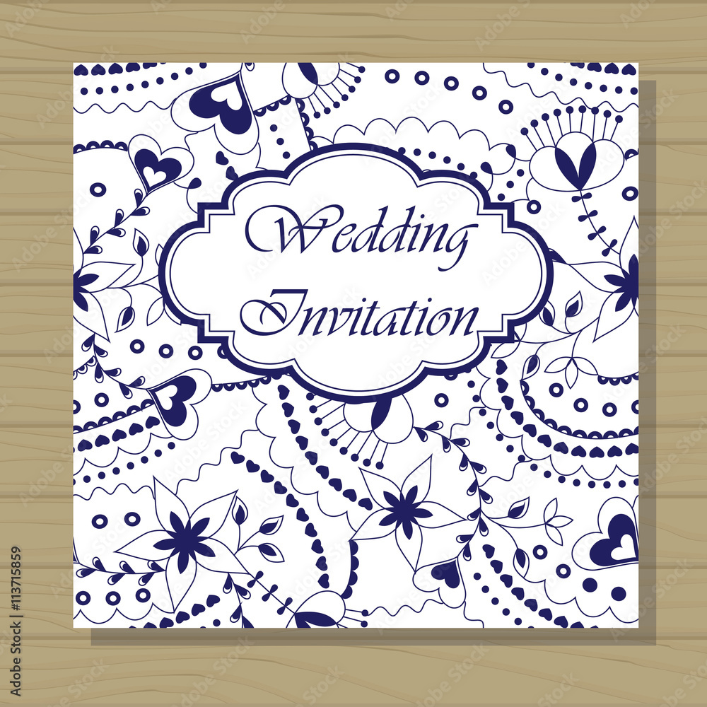 Wedding invitation on wooden background