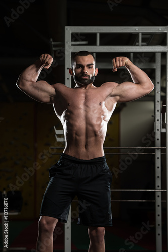 Bodybuilder Performing Front Double Biceps Pose
