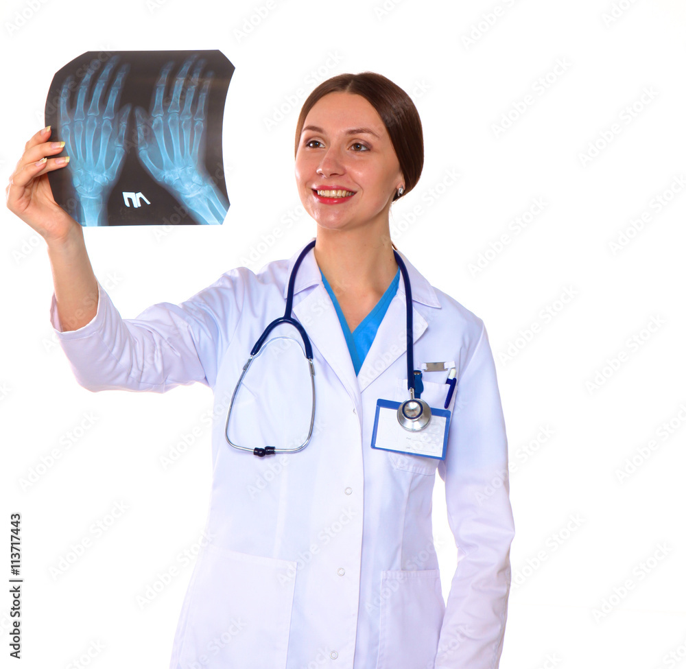 Young woman doctor examines the X-rays. Isolate Young woman doctor examines the X-rays. Isolate