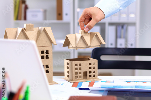 Photography Designer shows a model of a new home