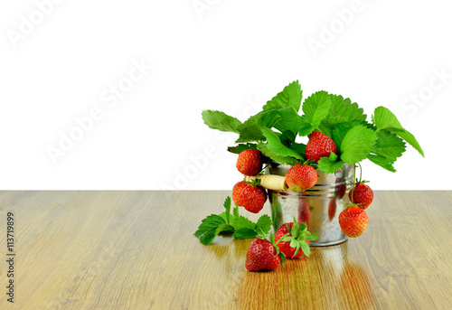 Delicious strawberries in a bucket . Gardening. Hobby. Agricultu photo