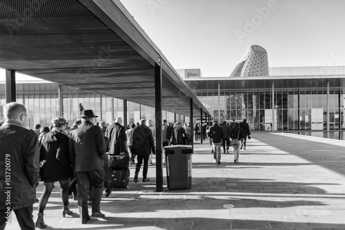 People come in buildings fairs in Milan, italy.