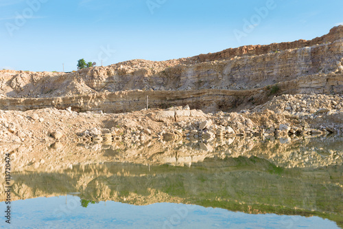 Lake in limestone quarry in the development of rock