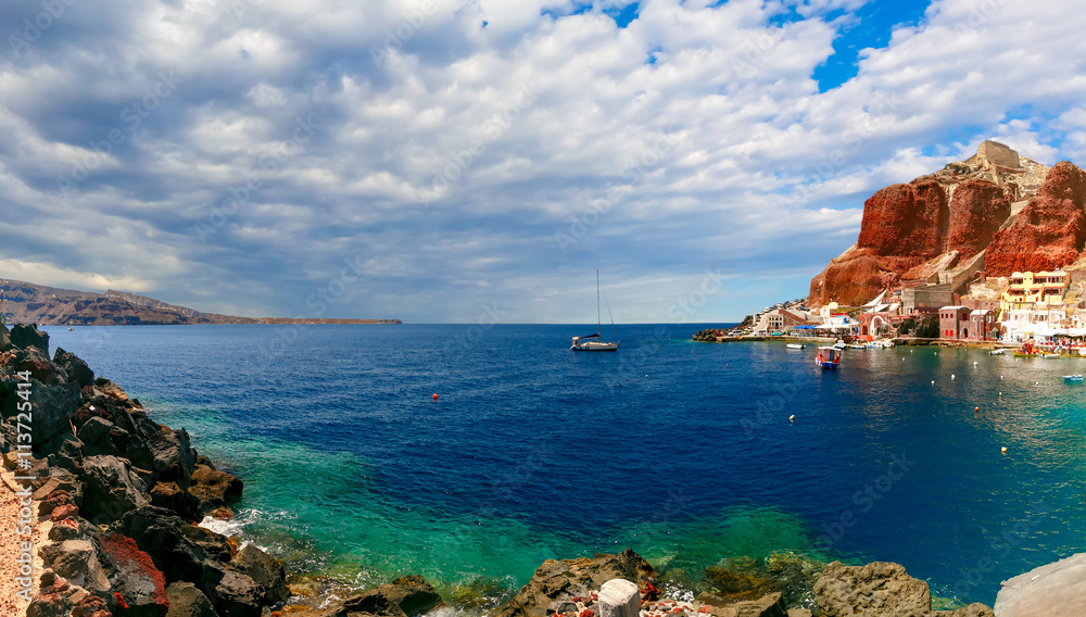 Panorama of Old port Ammoudi of Oia village at Santorini island in Aegean sea, Greece