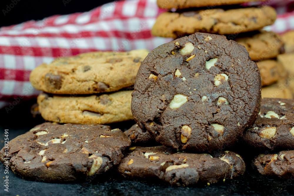 Fototapeta premium Chocolate chips cookies isolated on black background
