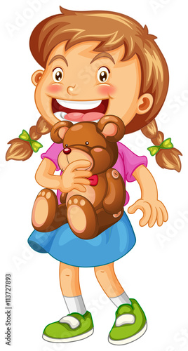 Girl hugging brown teddy bear