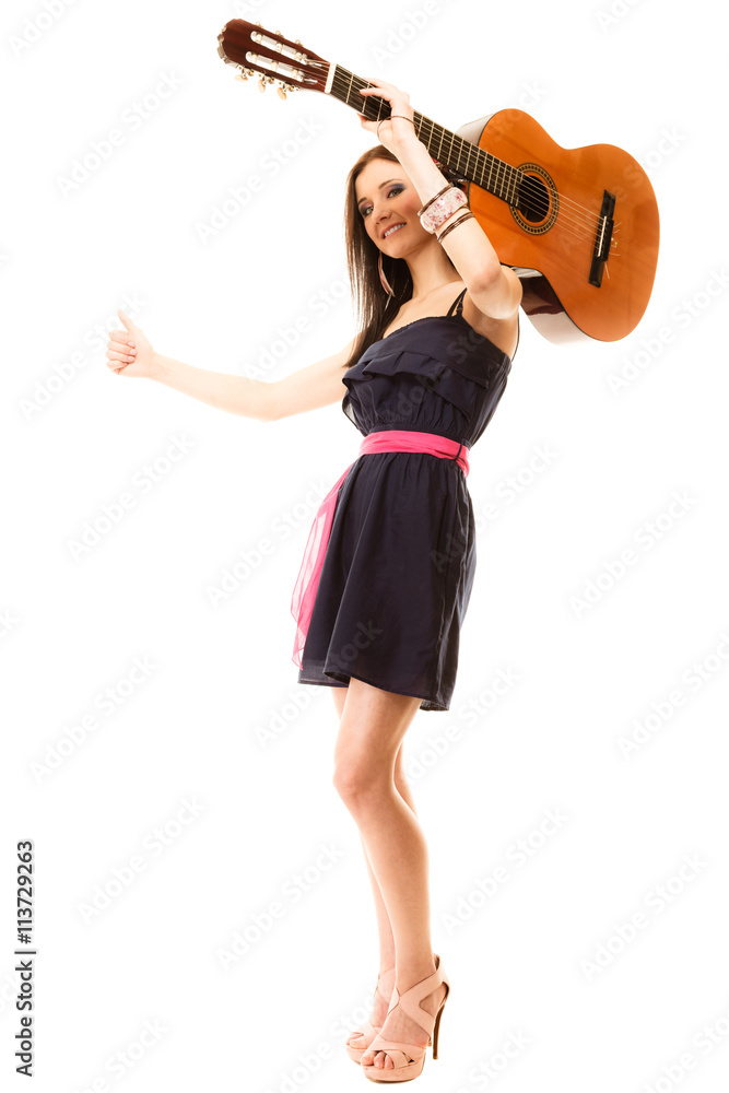 girl with guitar thumbing and hitch hiking isolated girl with guitar thumbing and hitch hiking isolated