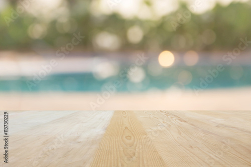 Blank area or space table top on blurred swiming pool background