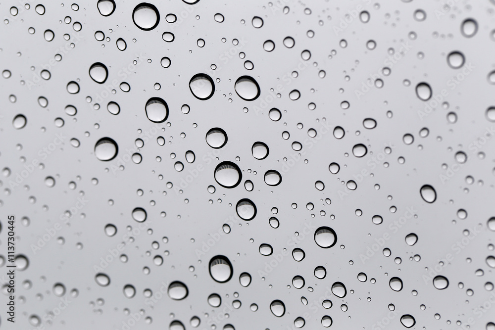 Drop of water for the background on glass car window to abstract Drop of water for the background on glass car window to abstract