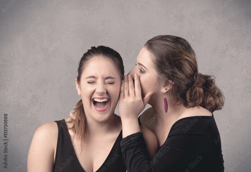 girl telling secret things to her girlfriend girl telling secret things to her girlfriend