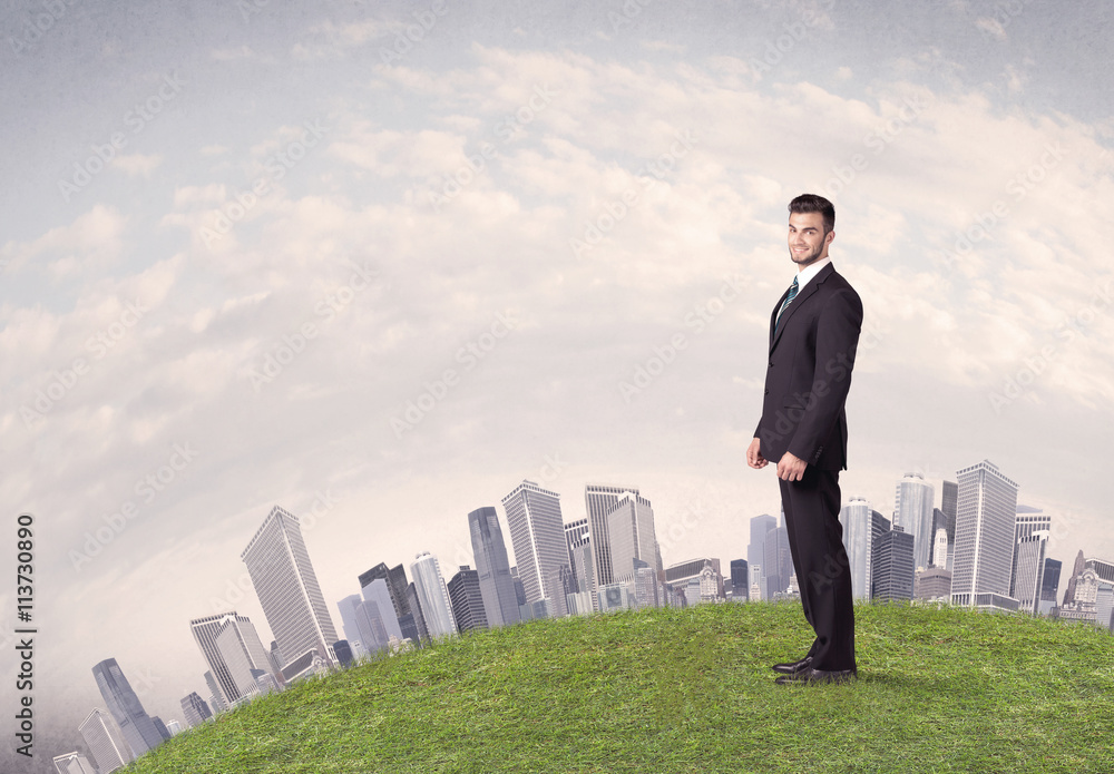 man standing in front of city landscape man standing in front of city landscape
