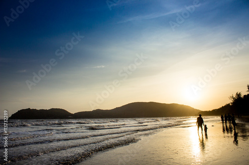 people on Beach in silhouette shot
