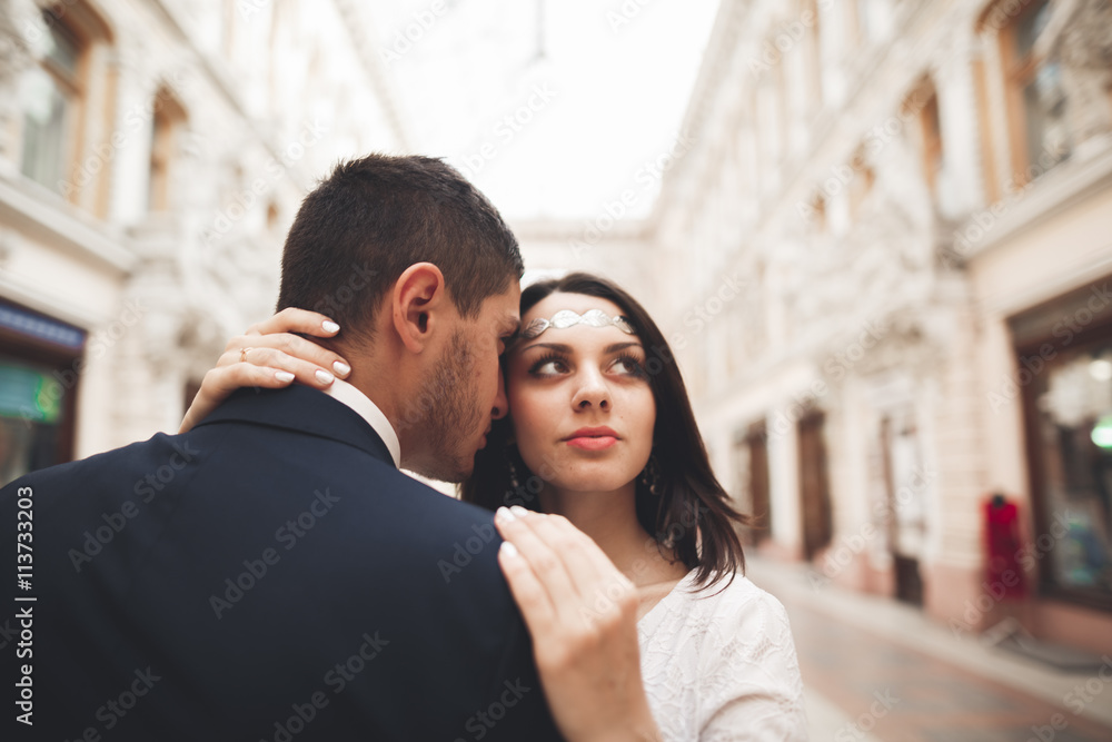 Loving couple posing in the old town Loving couple posing in the old town