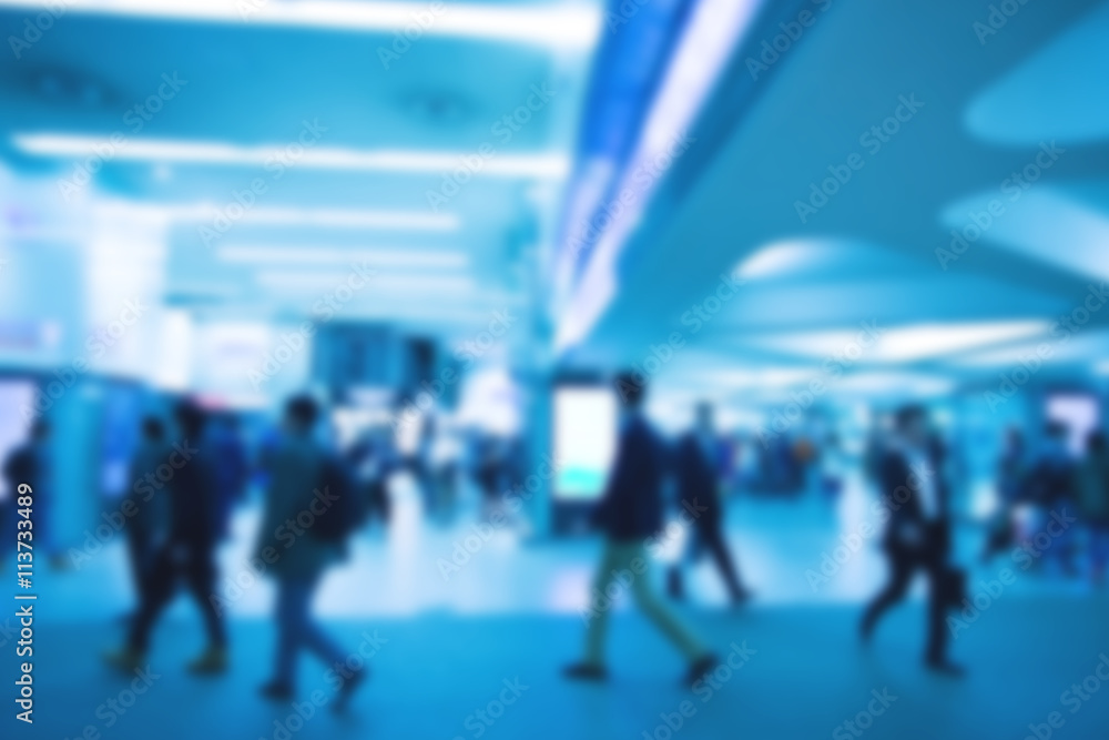 Blurred image of people with blue color filler Blurred image of people with blue color filler