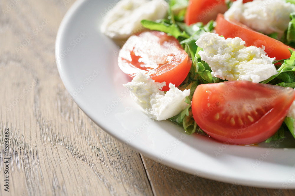 summer light salad with tomatoes, mozzarella and rocket leaves summer light salad with tomatoes, mozzarella and rocket leaves