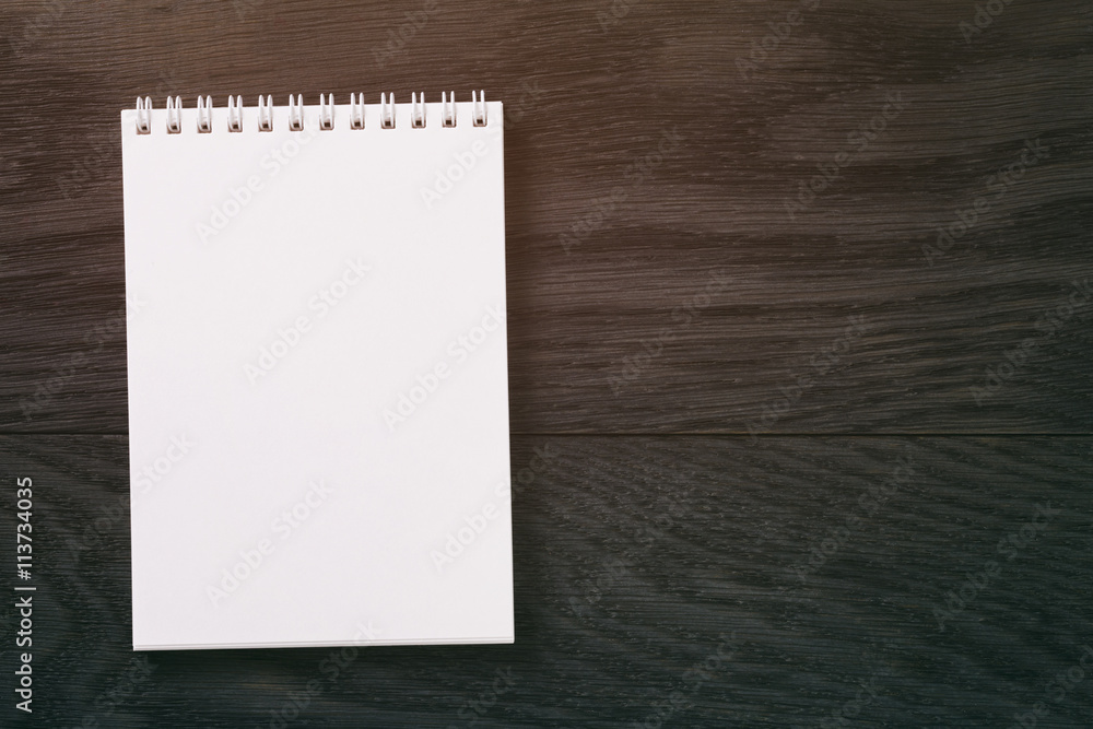 simple blank notepad on rustic wood table simple blank notepad on rustic wood table