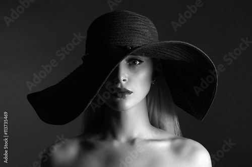 monochrome portrait of Beautiful woman in hat. fashion beauty girl