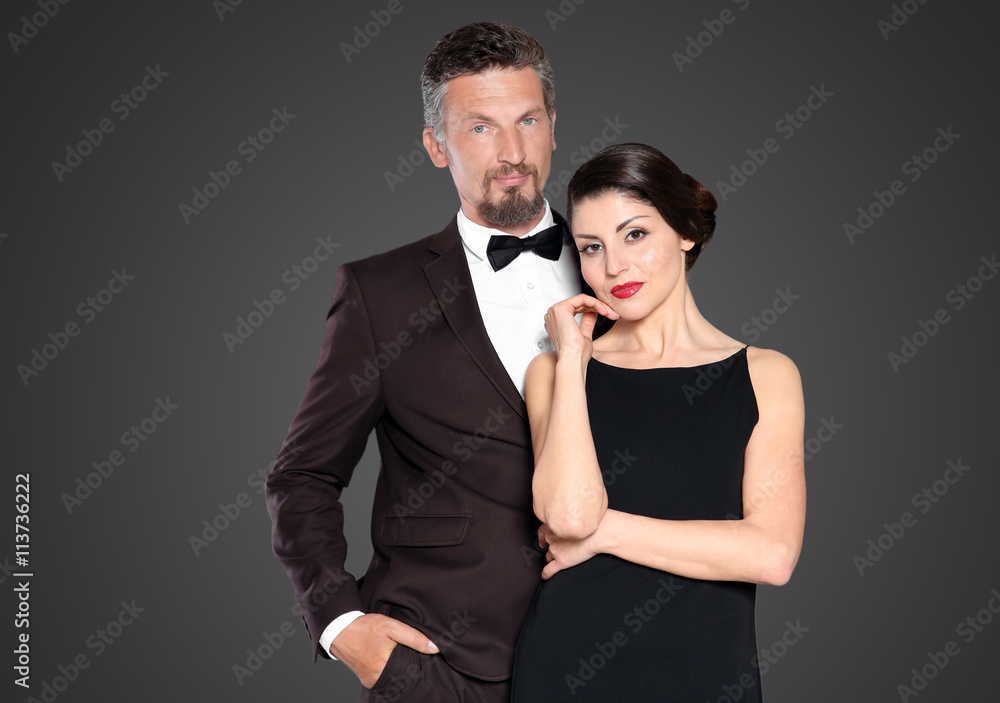 Happy mature couple on dark background Happy mature couple on dark background
