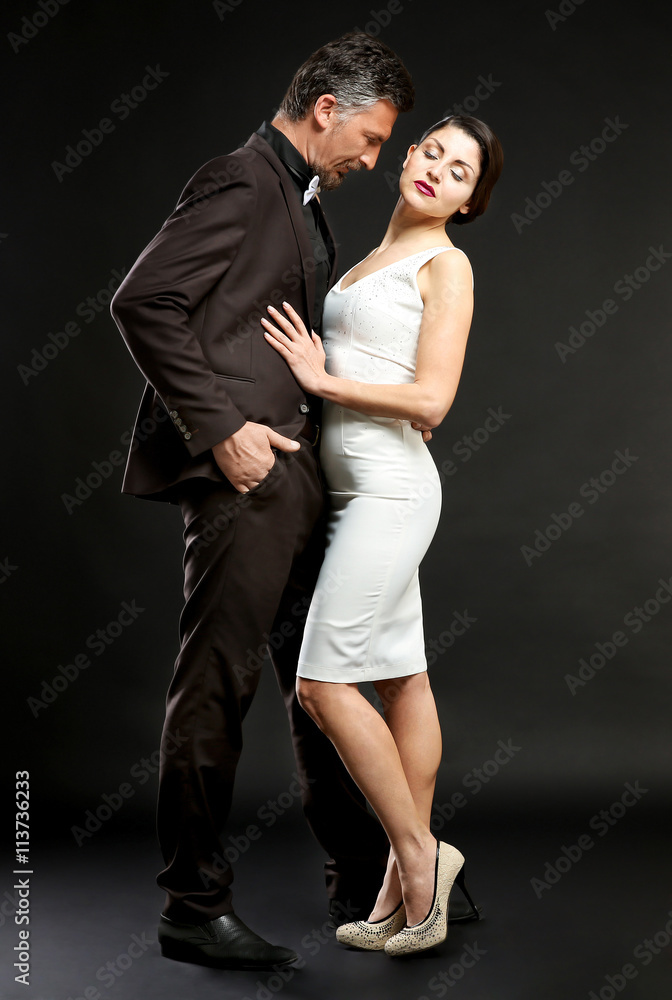 Happy mature couple on dark background Happy mature couple on dark background