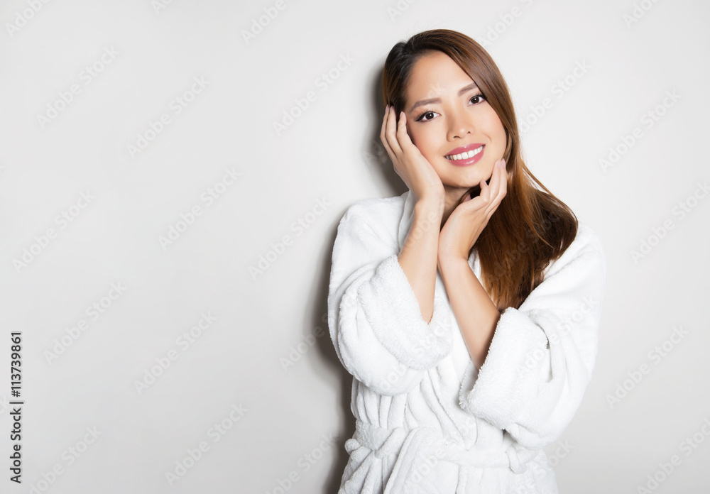 beautiful, happy young woman with flawless skin and long hair posing in bath robe beautiful, happy young woman with flawless skin and long hair posing in bath robe