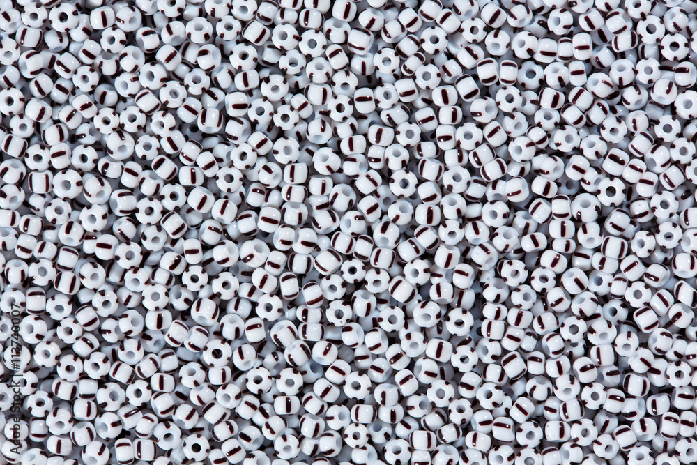 White beads with black line. White beads with black line.