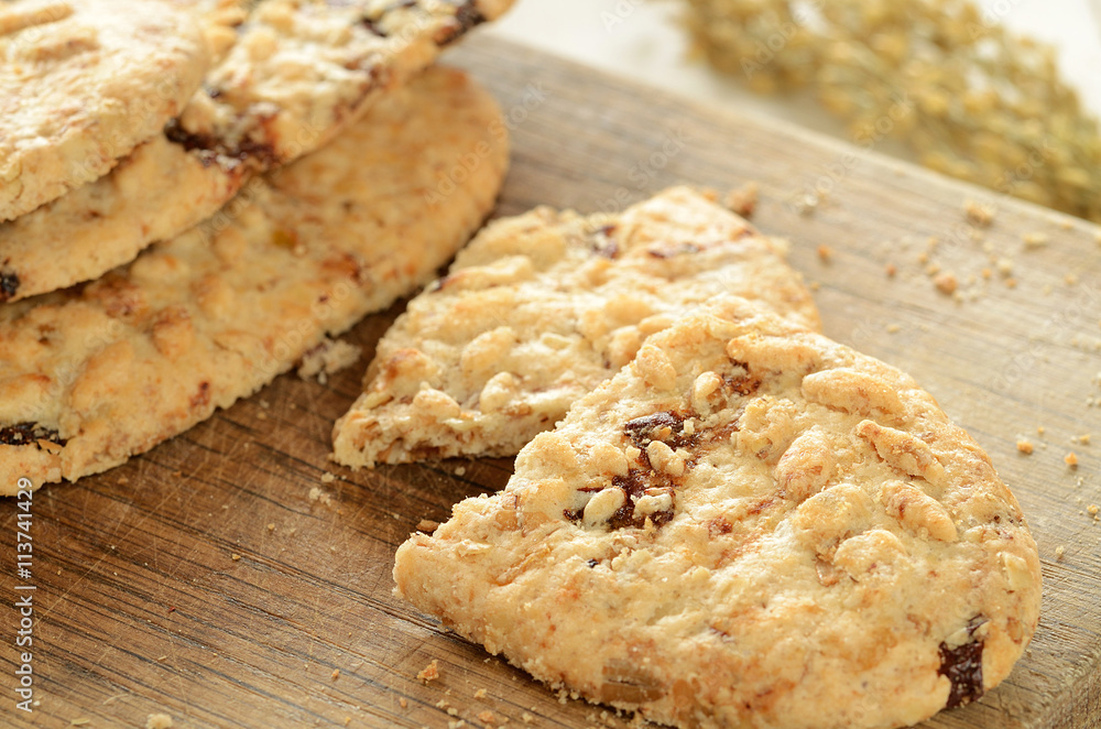 Close-up of cereal biscuits on wooden cutting board Close-up of cereal biscuits on wooden cutting board
