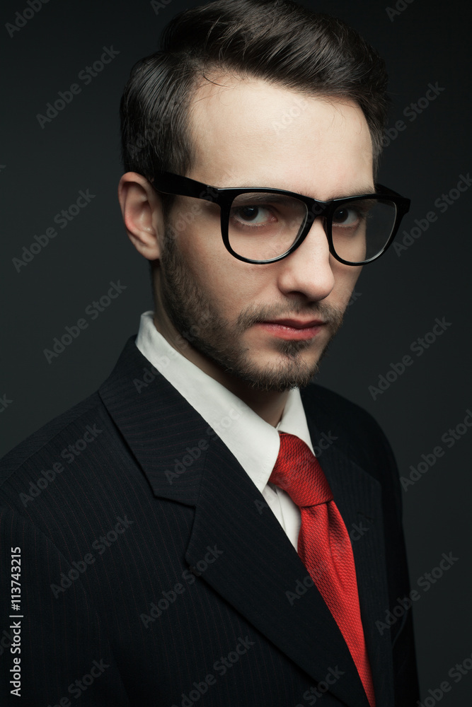 Eyewear concept. Portrait of young handsome man in black suit Eyewear concept. Portrait of young handsome man in black suit