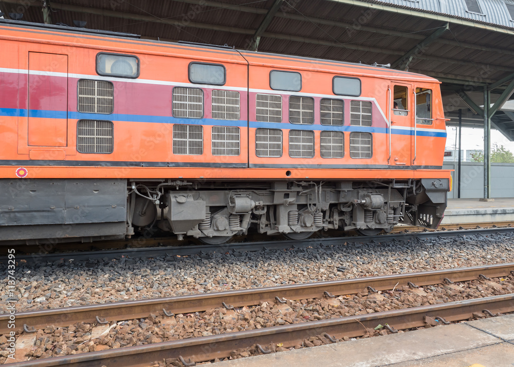 Red orange train, Diesel locomotive, on railway station