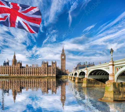 Big Ben with flag of England in London, UK