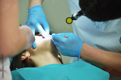 Dentist doing operation
