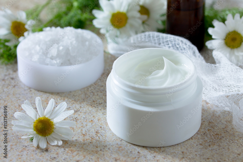 Face cream with chamomile essential oil bottle of aromatherapy a Face cream with chamomile essential oil bottle of aromatherapy a