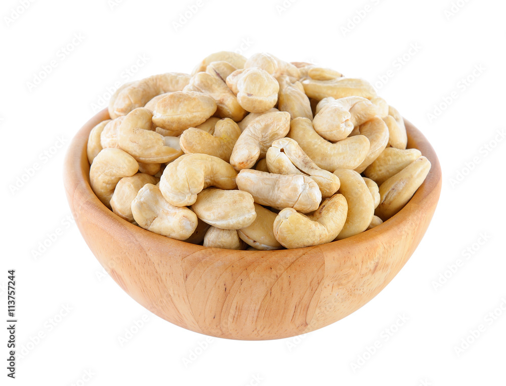 cashew nut in wood bowl on white background cashew nut in wood bowl on white background