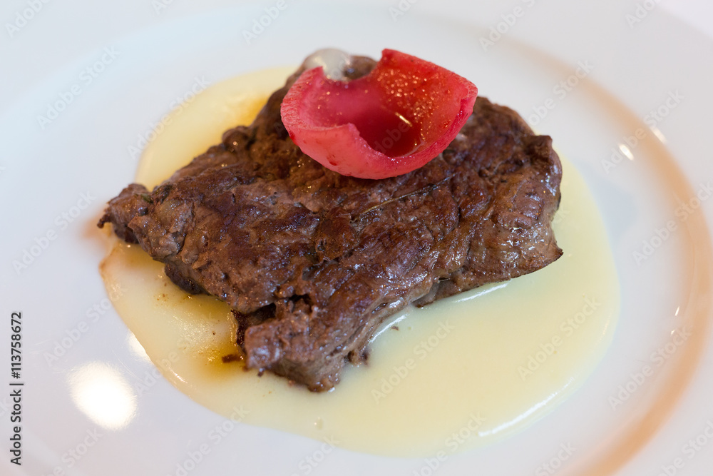 Beef tenderloin crusted with caramelized onions and colonnaded Beef tenderloin crusted with caramelized onions and colonnaded