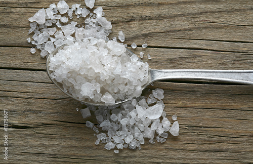 spoon and salt on old wooden