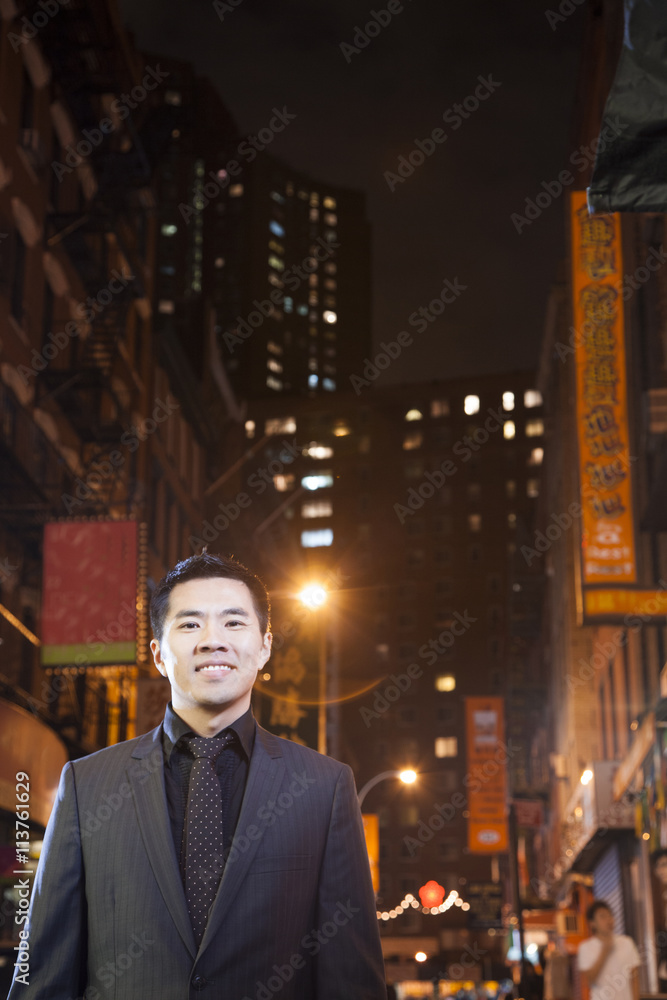 Asian man in chinatown at night Asian man in chinatown at night