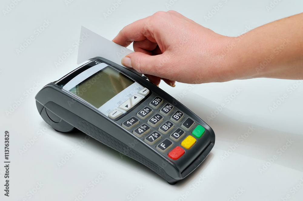 The girl holds in hand a credit card The girl holds in hand a credit card