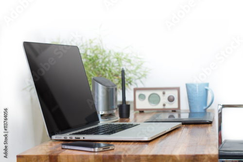 laptop on wooden desk