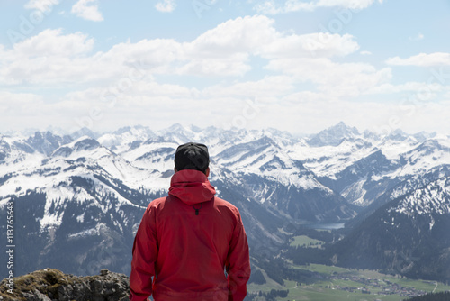hiker enjoying view from Aggenstein