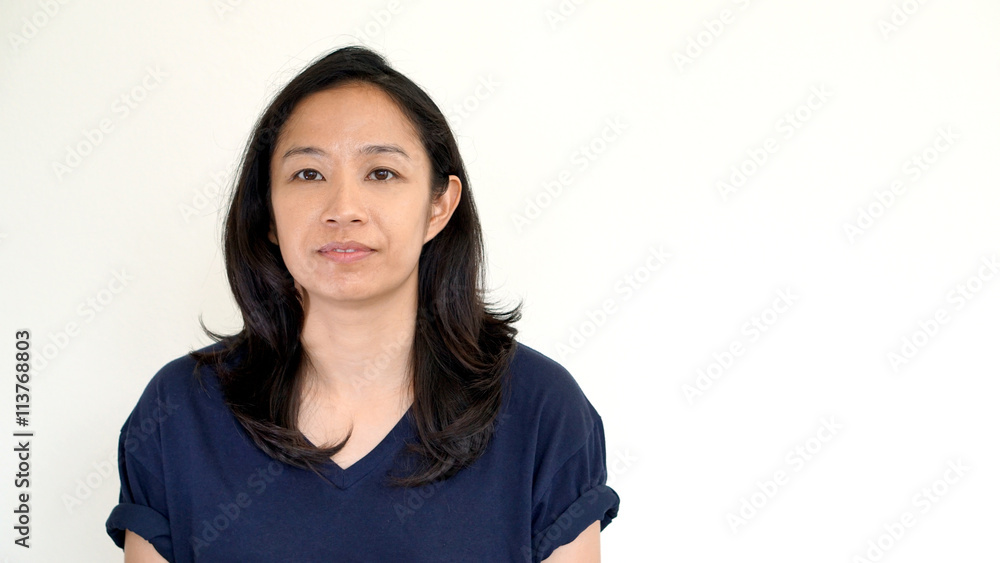 Casual asian girl on white background smiling face with relax te Casual asian girl on white background smiling face with relax te