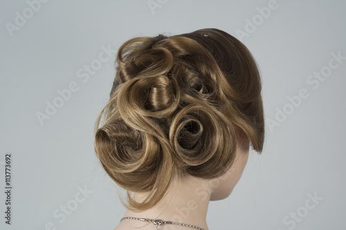 Beauty with hair in romantic style