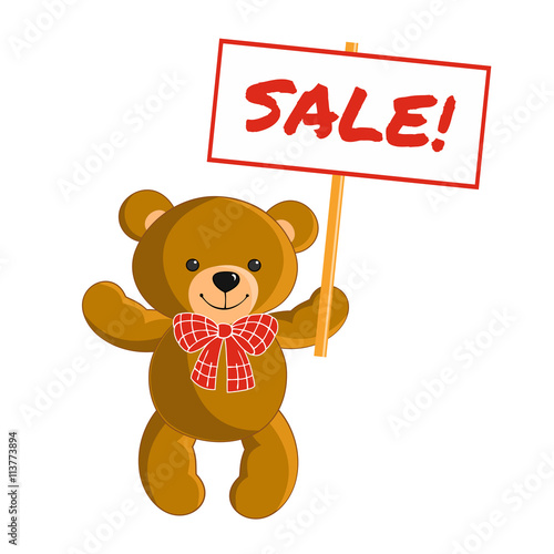 Toy teddy bear holds sign "Sale"