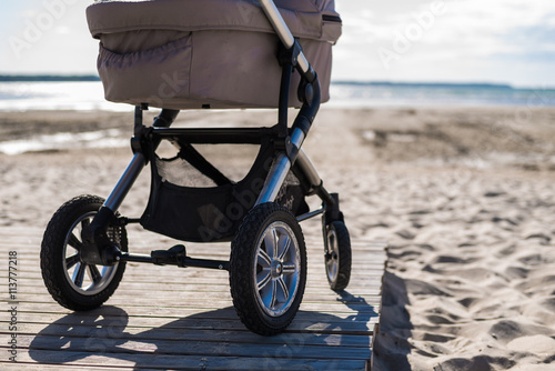 Fényképezés Baby stroller on beach