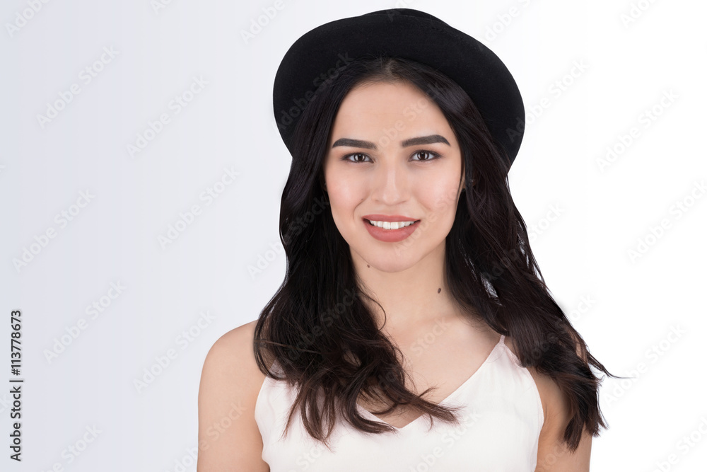 Girl portrait of a stylish young brunette in a black hat Girl portrait of a stylish young brunette in a black hat